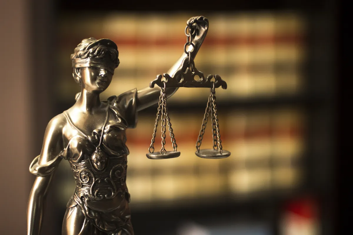 Law books and legal documents on an attorney's desk